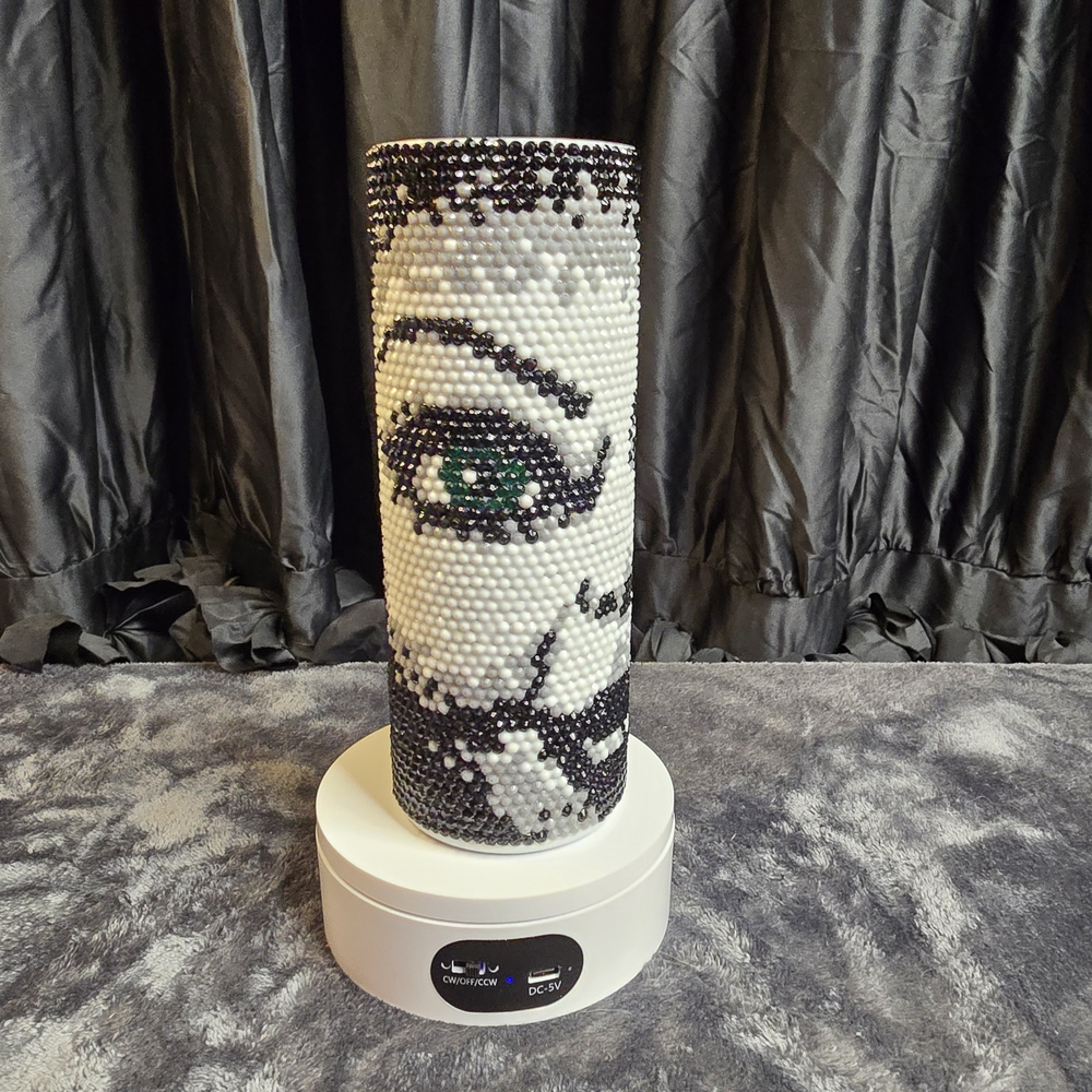 Artistic Beaded Vase with Eye Design